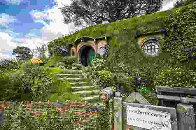 The Hobbiton Movie Set In New Zealand, A Recreation Of The Hobbit Village From The Lord Of The Rings Film Trilogy. New Zealand With A Hobbit Botherer